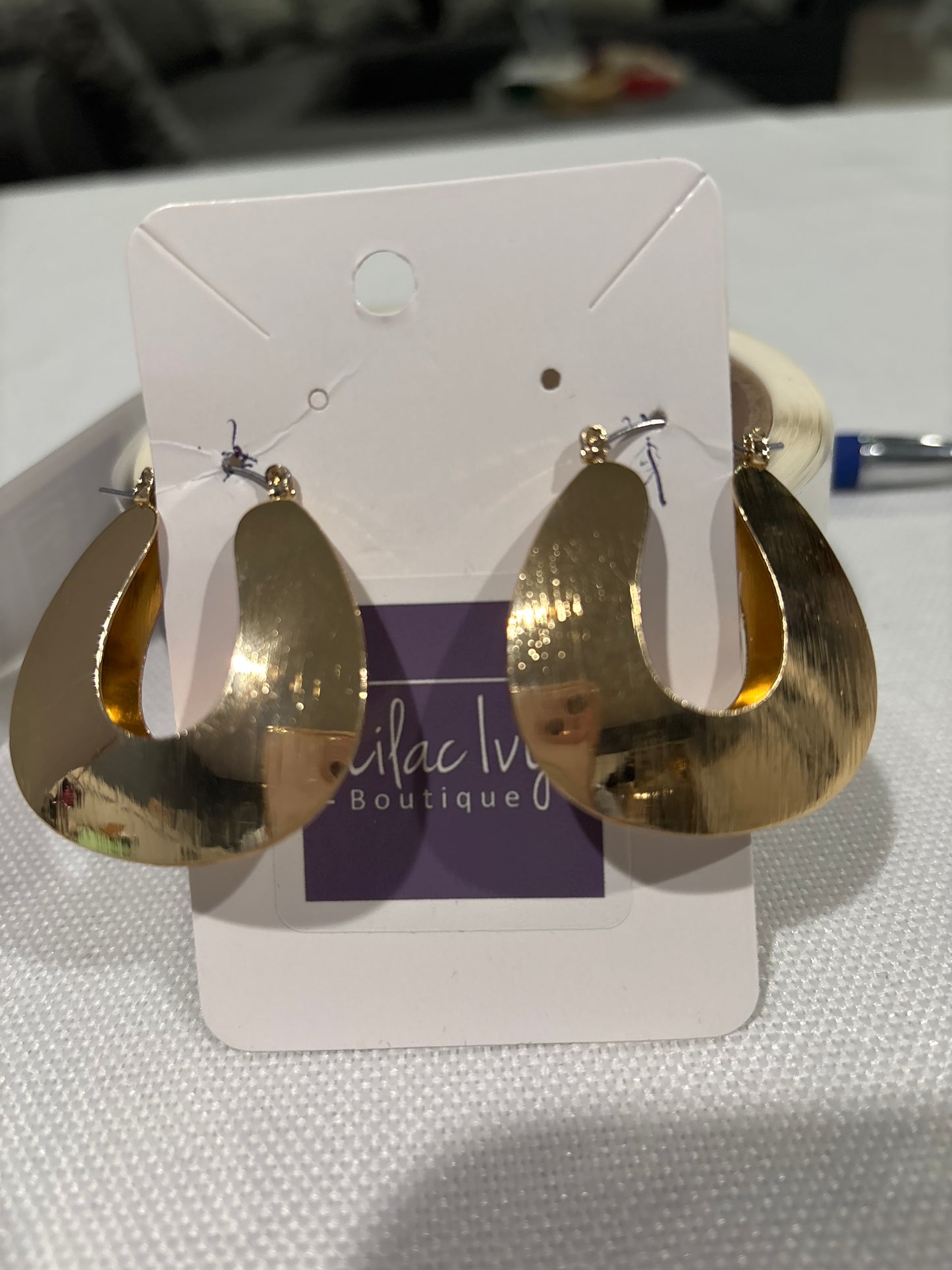 Gold wire horseshoe shaped drop earrings