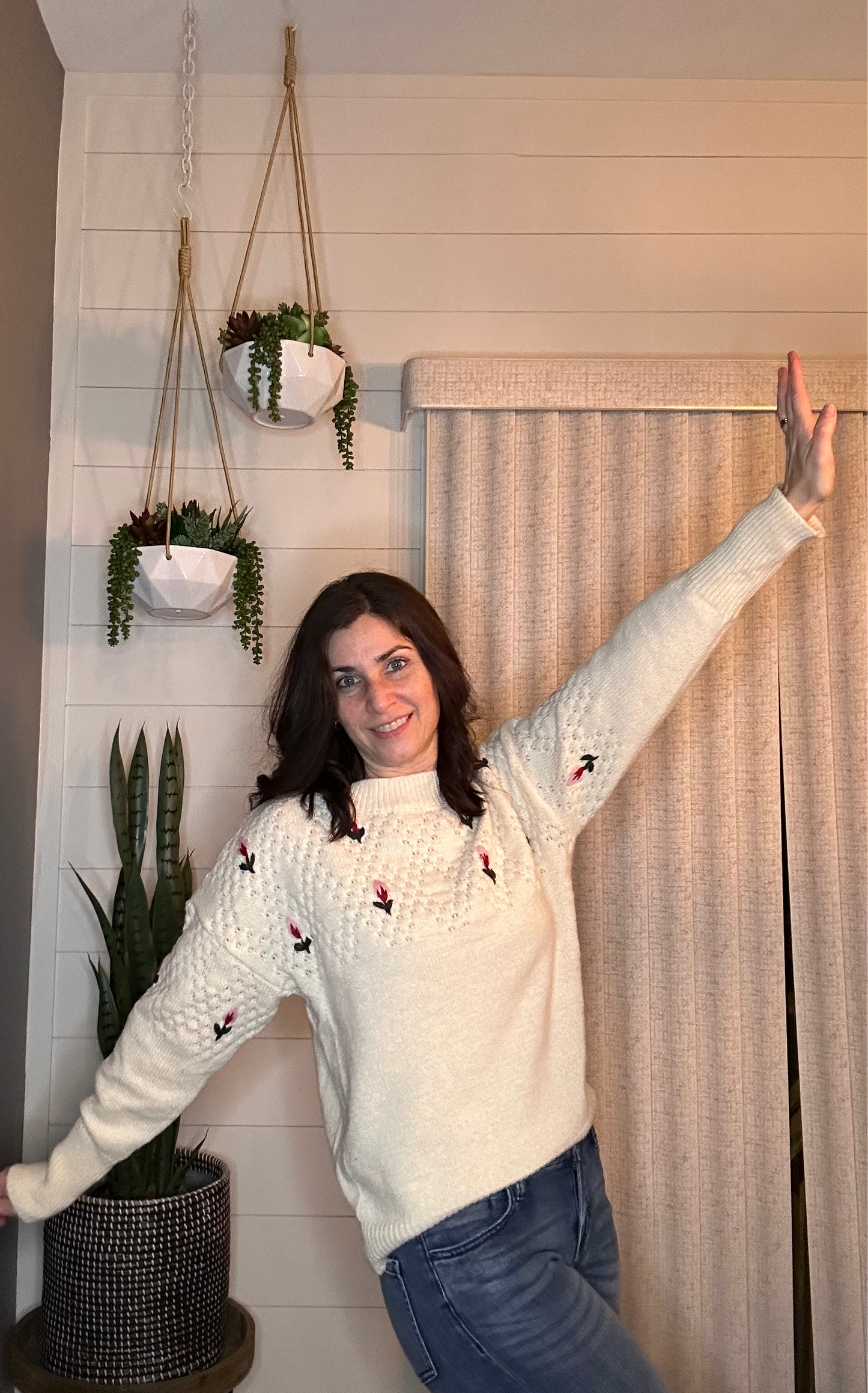 Sweater with floral appliqués