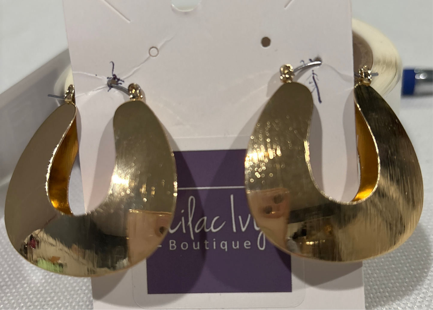Gold wire horseshoe shaped drop earrings
