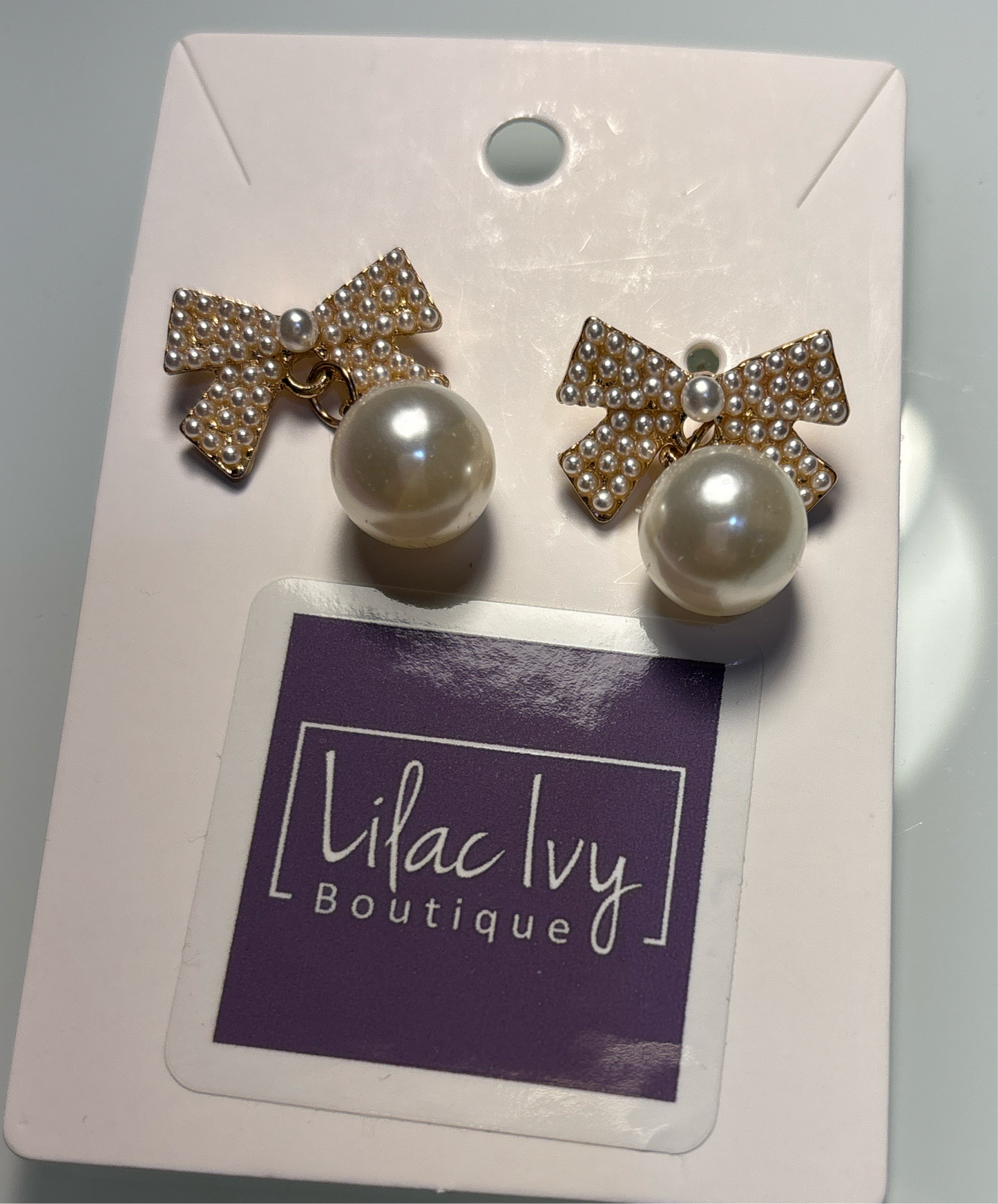 Pearl bow earrings with dropped pearl