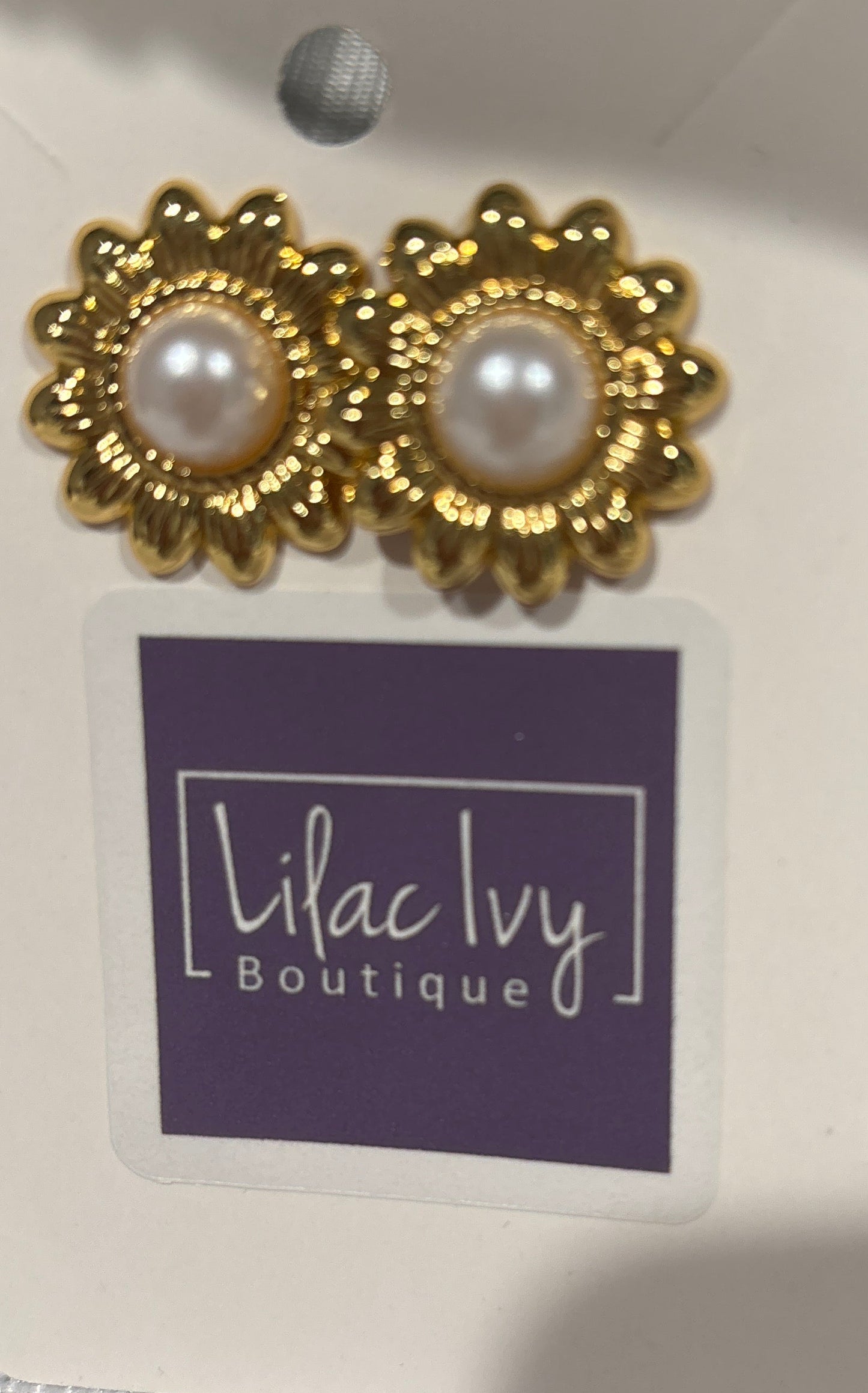 Gold daisy earrings with pearl center