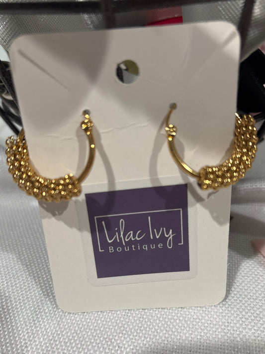 Gold hoops with textured rings