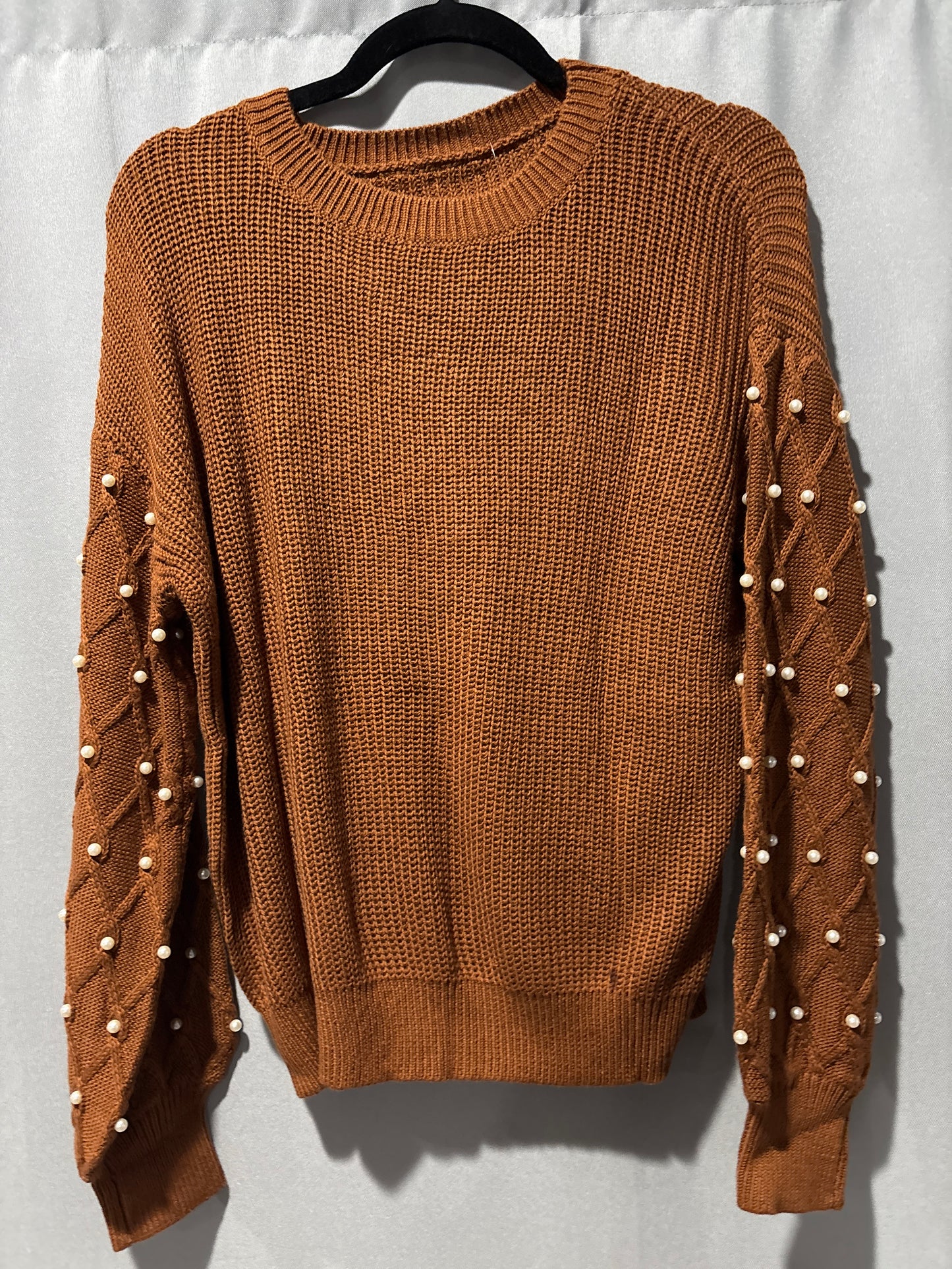 Knit sweater with pearl embellished sleeves