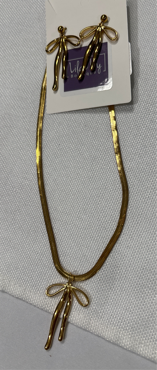 Gold bow pennant with matching earrings