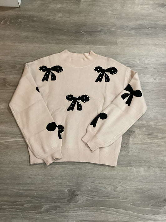 Mock neck sweater with black bows and pearls