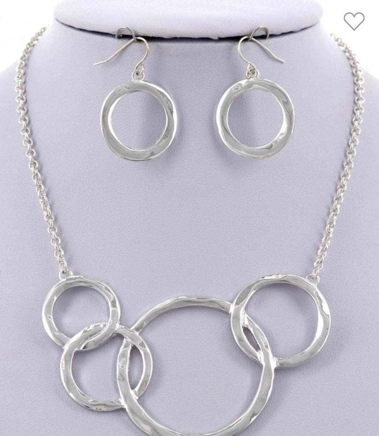 Overlapping, hammered rings, necklace, and earrings