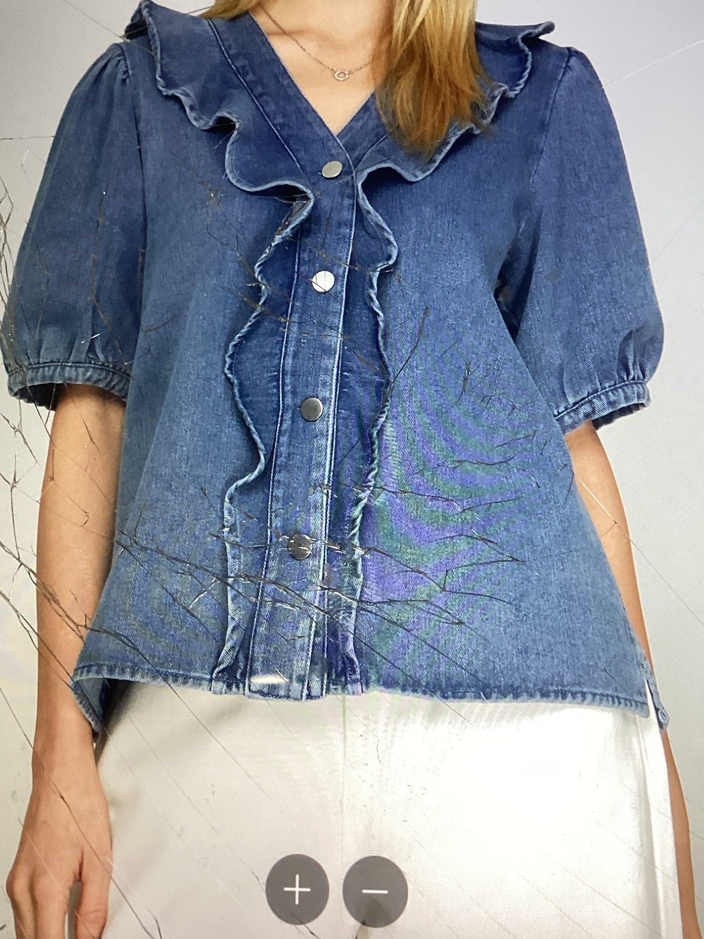 Washed denim ruffled top