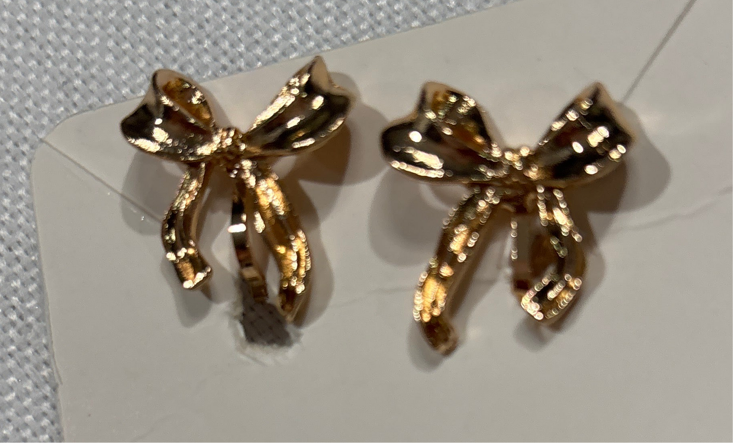 Gold bow clip on earrings