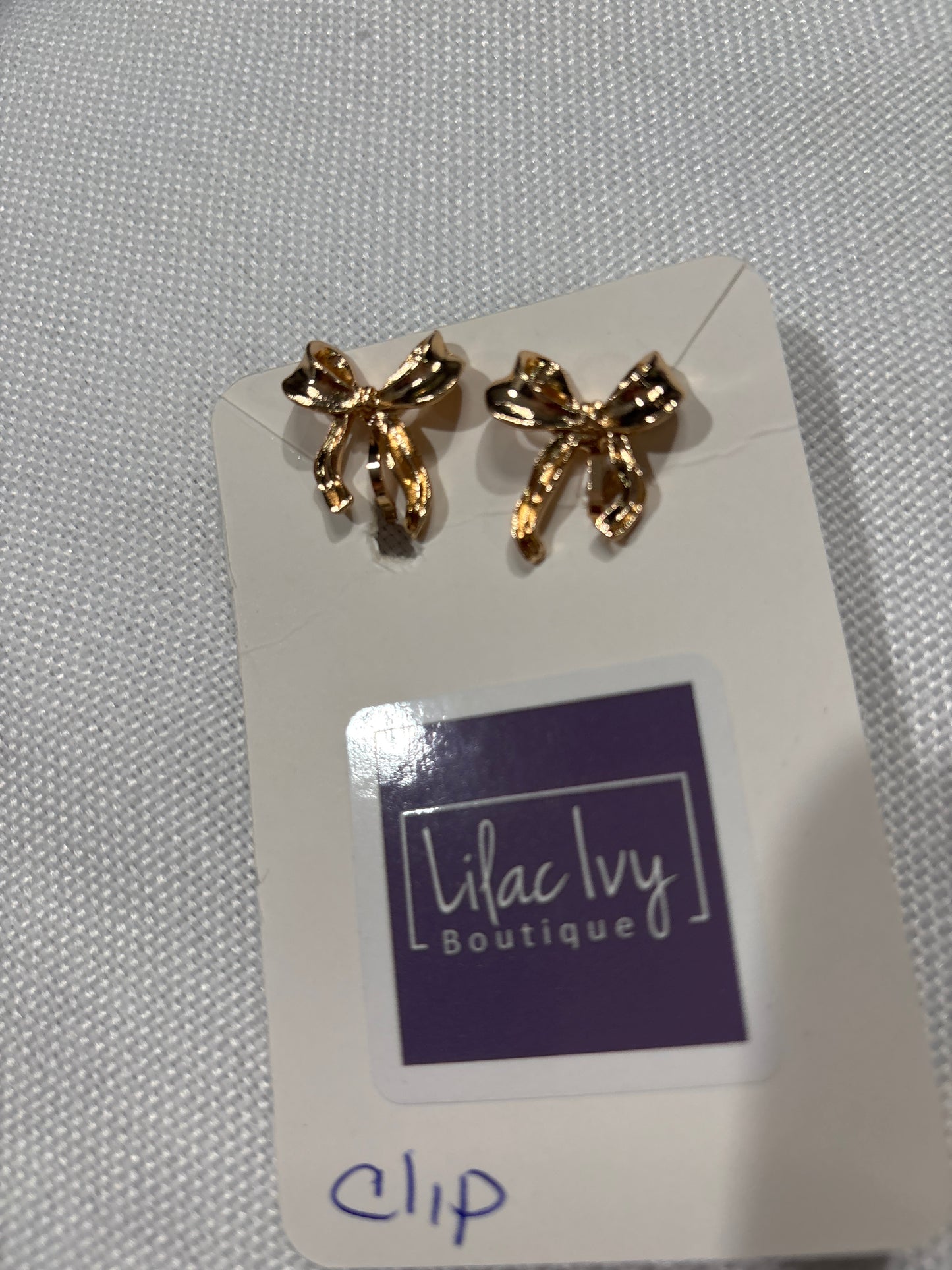 Gold bow clip on earrings