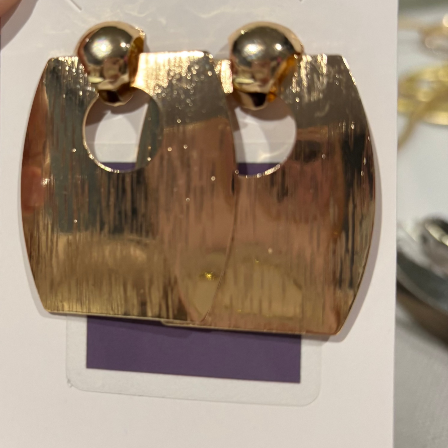 Gold square earrings with center hole